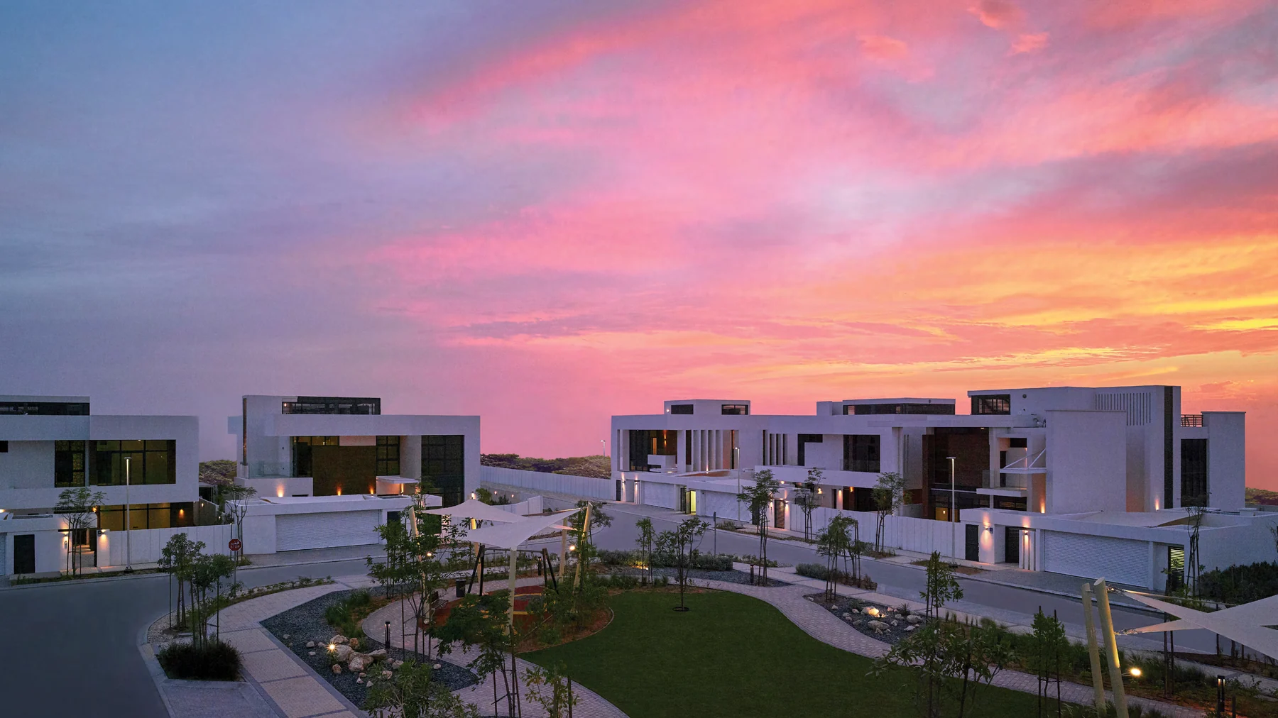 West Yas villas and landscaped streets at sunset on Yas Island