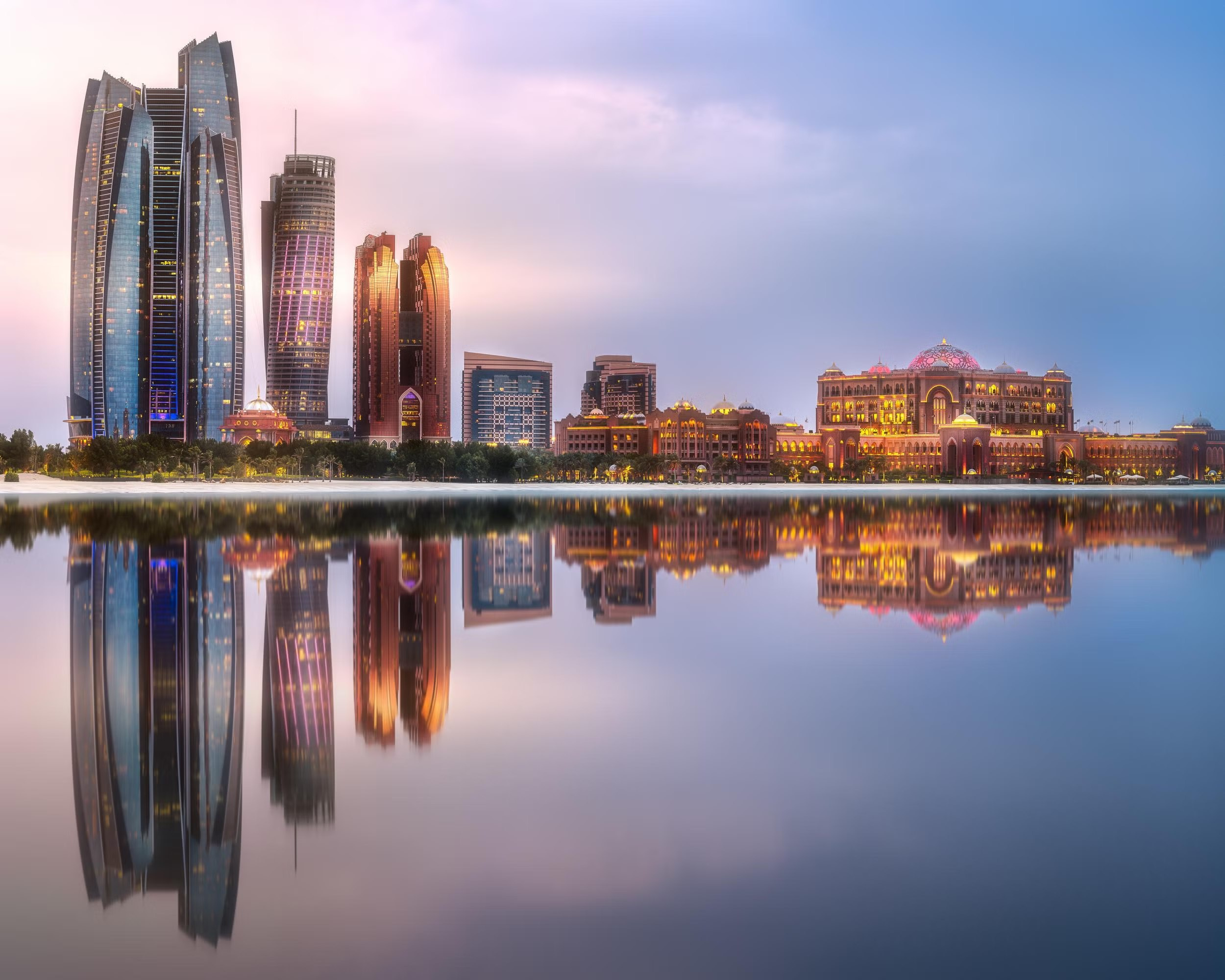 Abu Dhabi skyline reflected at sunset
